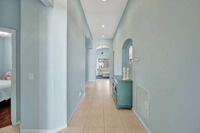 corridor with light tile patterned flooring