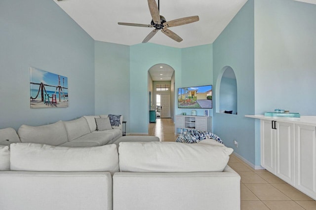 living room featuring light tile patterned flooring and ceiling fan