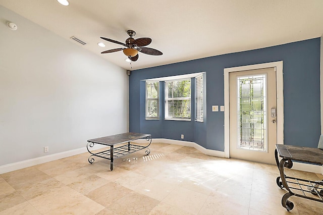 interior space featuring ceiling fan