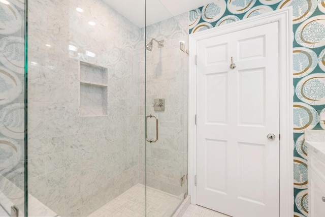 bathroom with a shower with shower door