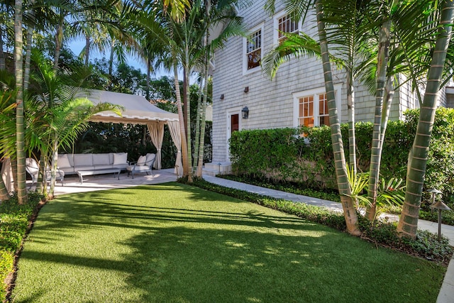 view of yard featuring an outdoor living space, a gazebo, and a patio