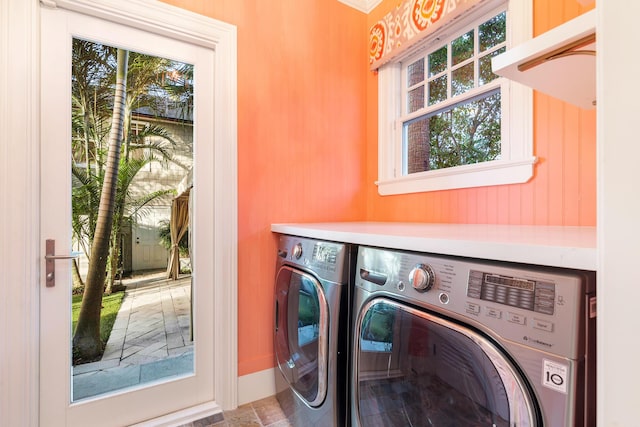 laundry room with a wealth of natural light and washing machine and dryer