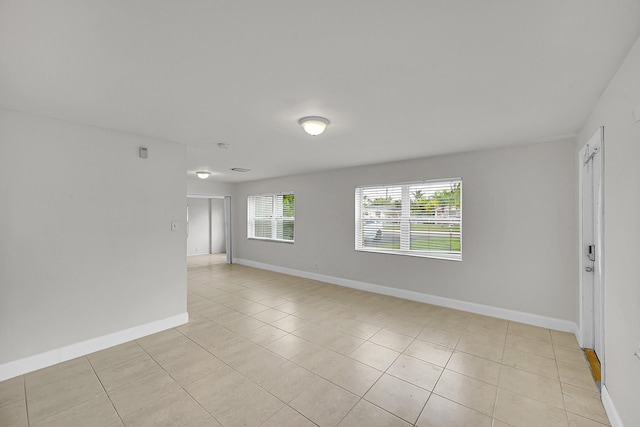 empty room with light tile patterned floors