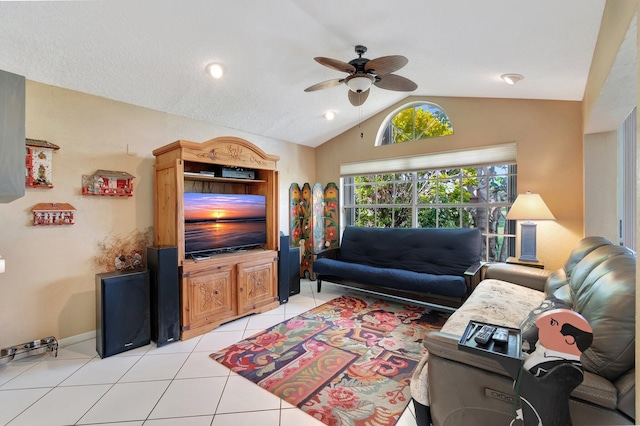 tiled living room featuring vaulted ceiling and ceiling fan