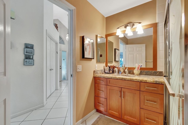 bathroom with tile patterned flooring and vanity