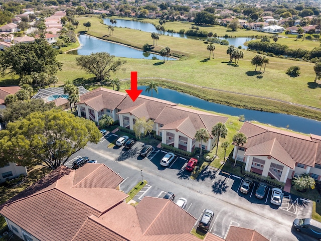 drone / aerial view with a water view