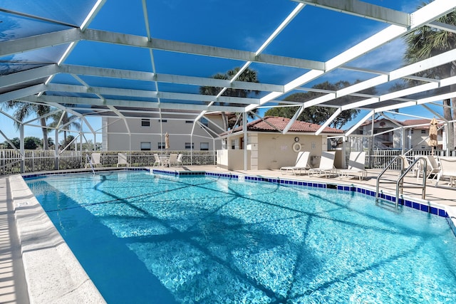 view of pool featuring a lanai and a patio area