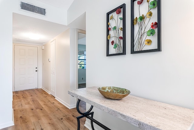 hallway featuring light hardwood / wood-style flooring