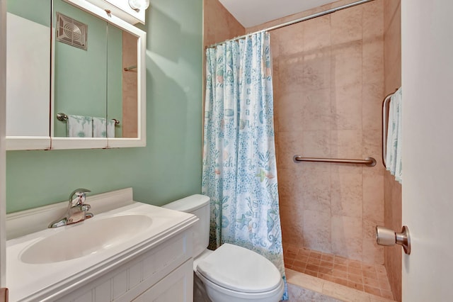 bathroom featuring vanity, toilet, and a shower with shower curtain