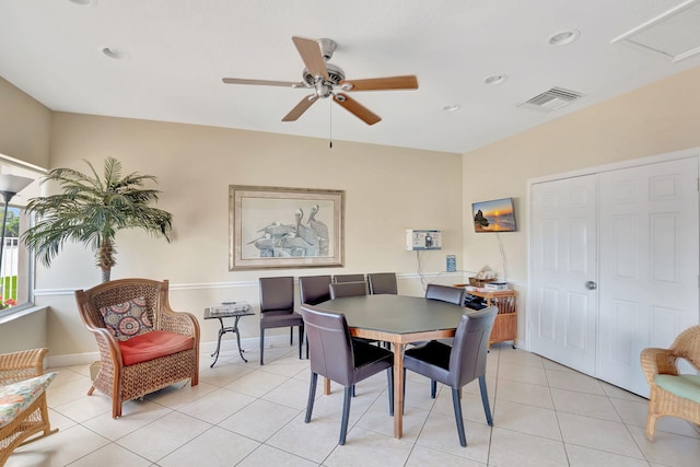 tiled dining room with ceiling fan