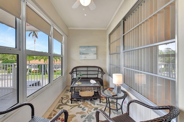 sunroom / solarium featuring ceiling fan