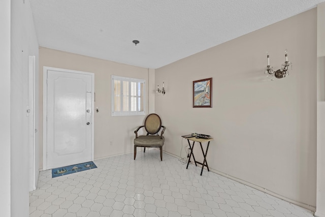 entryway featuring a textured ceiling