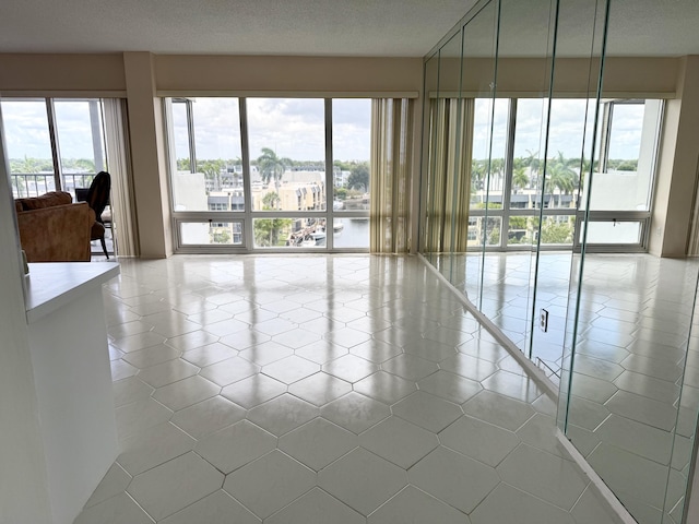 801 S Federal Hwy Unit 618, Pompano Beach, FL 33062 - unfurnished room featuring plenty of natural light and tile patterned floors