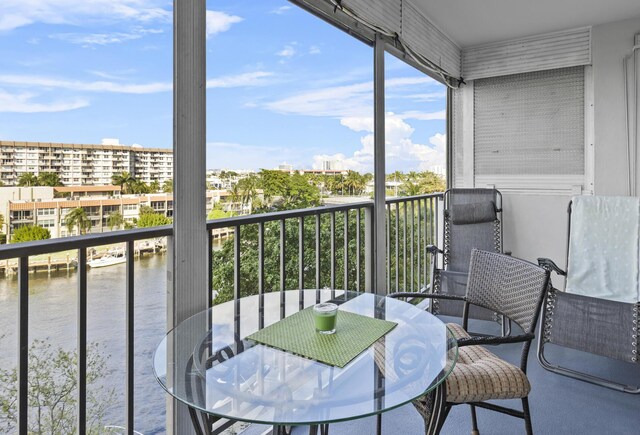 801 S Federal Hwy Unit 618, Pompano Beach, FL 33062 - balcony with outdoor dining area and a water view