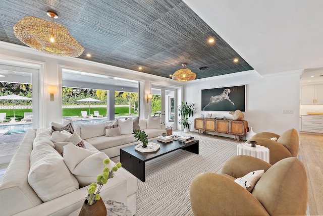 living room featuring crown molding and light wood-type flooring