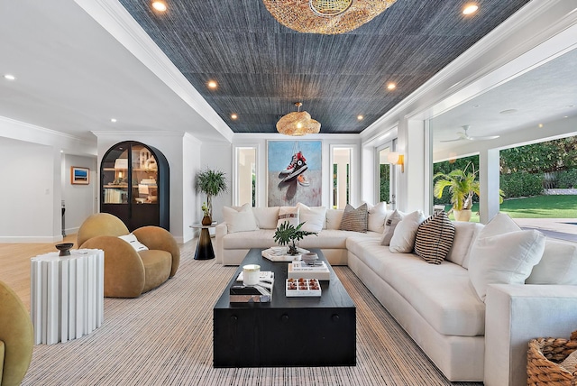 living room with ornamental molding and a healthy amount of sunlight