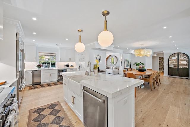 kitchen featuring sink, white cabinets, beverage cooler, a kitchen island with sink, and stainless steel dishwasher