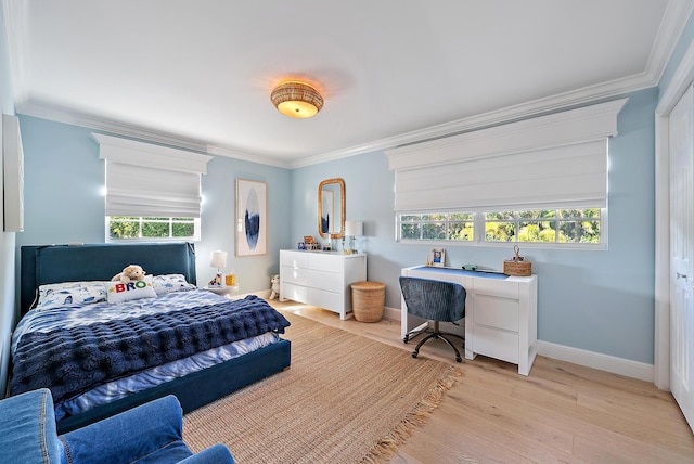 bedroom featuring light hardwood / wood-style flooring and ornamental molding