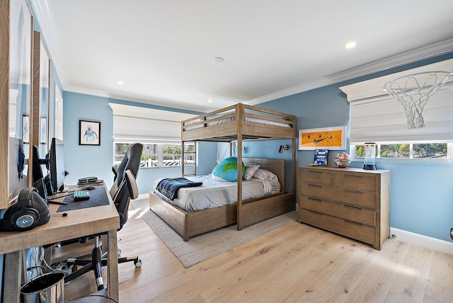 bedroom with multiple windows, ornamental molding, and light hardwood / wood-style floors