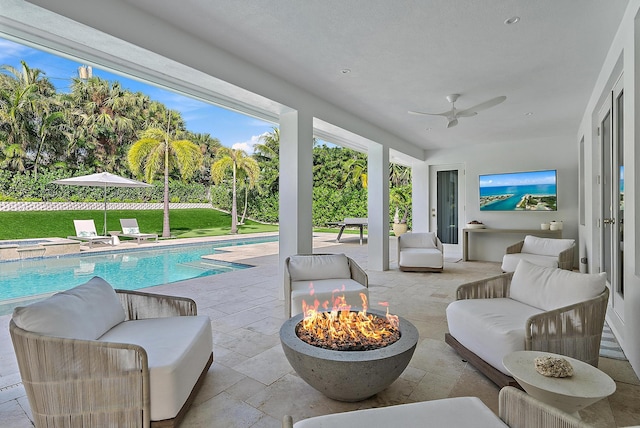 exterior space featuring a fenced in pool, an outdoor living space with a fire pit, and ceiling fan