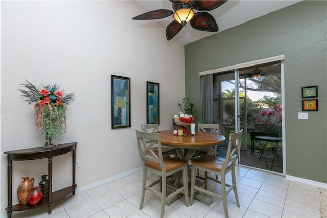 tiled dining space with ceiling fan