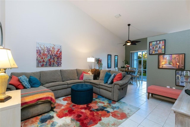 living room with ceiling fan, light tile patterned floors, and high vaulted ceiling