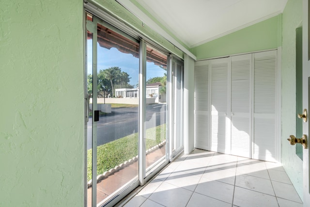 unfurnished sunroom with vaulted ceiling