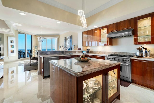 kitchen featuring appliances with stainless steel finishes, range hood, a center island, decorative light fixtures, and kitchen peninsula