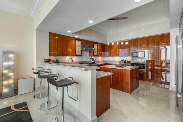 kitchen featuring built in microwave, crown molding, hanging light fixtures, kitchen peninsula, and a kitchen island