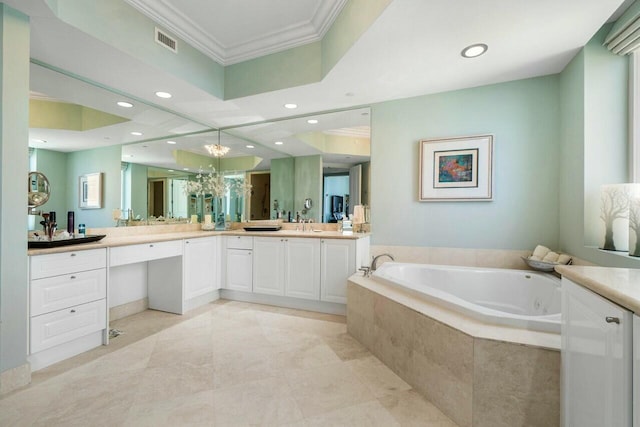 bathroom featuring tiled tub, vanity, and crown molding