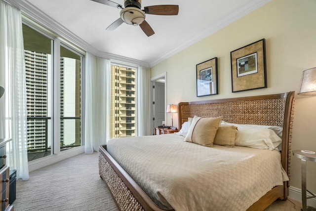 carpeted bedroom featuring ceiling fan, ornamental molding, multiple windows, and access to outside