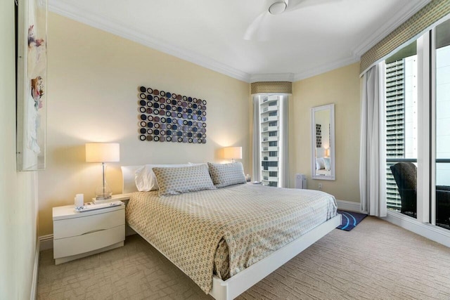 bedroom with crown molding and carpet