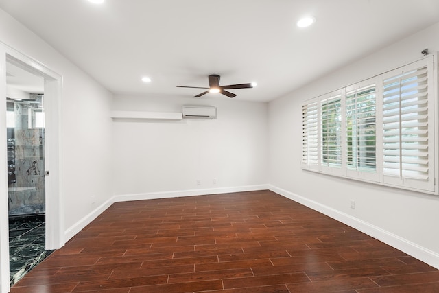 empty room featuring ceiling fan, dark hardwood / wood-style floors, and a wall mounted AC