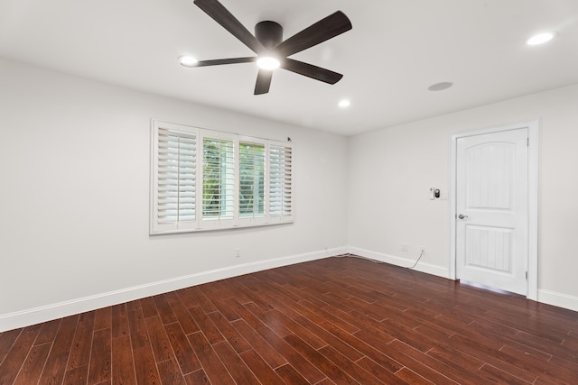 empty room featuring dark wood-type flooring and ceiling fan