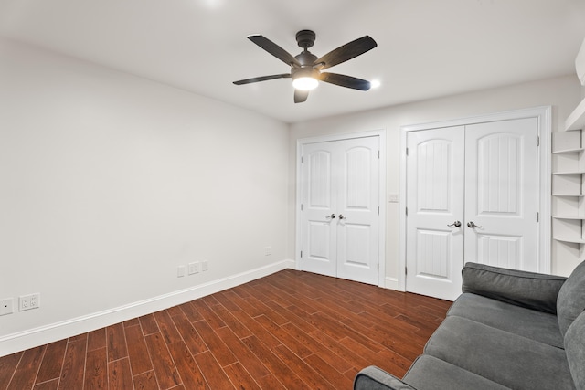 unfurnished room featuring dark hardwood / wood-style floors and ceiling fan