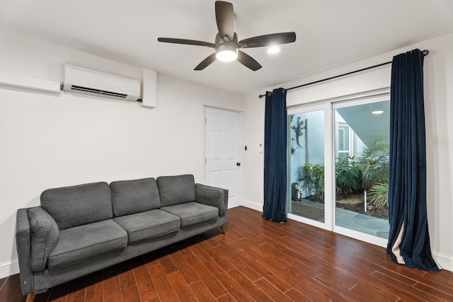 living room with a wall unit AC, dark hardwood / wood-style floors, and ceiling fan