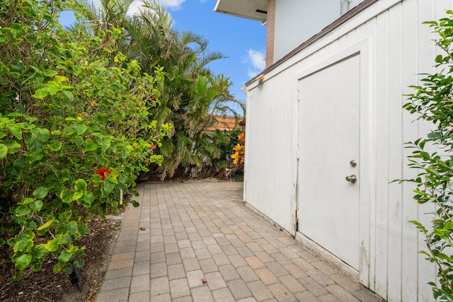 view of patio / terrace featuring a storage unit