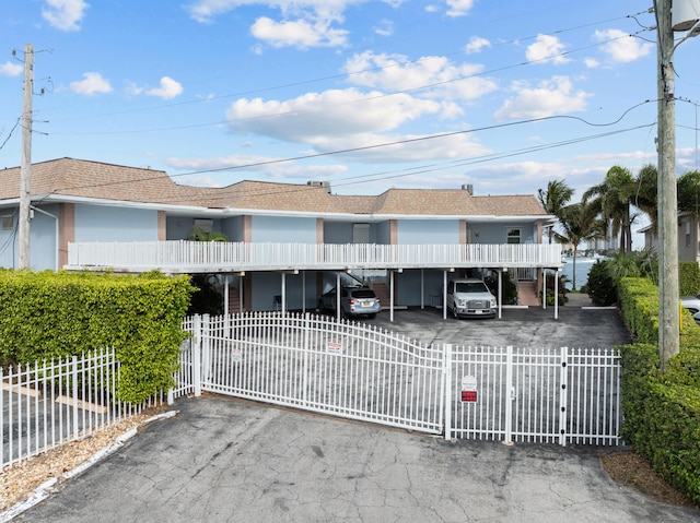 view of front of property featuring a carport