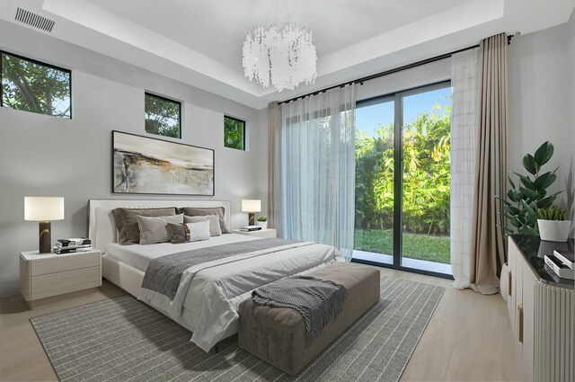 unfurnished living room featuring coffered ceiling, a notable chandelier, a high end fireplace, and light hardwood / wood-style floors