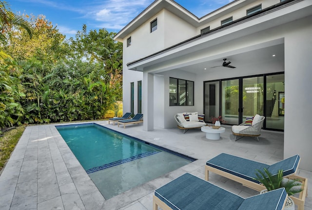 view of swimming pool with a patio area and ceiling fan