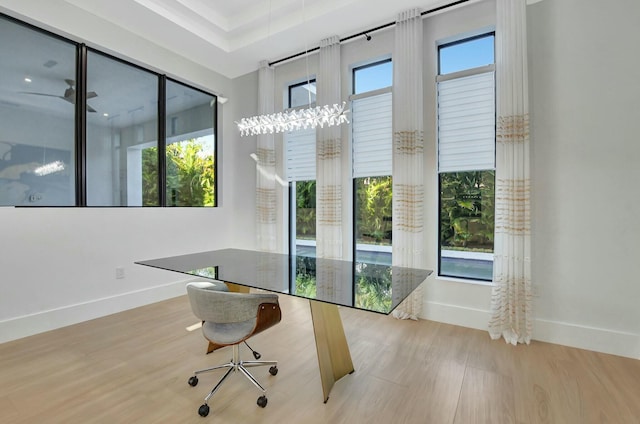 office area with a wealth of natural light and light wood-type flooring