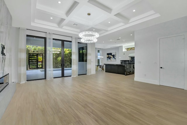 living room with french doors, coffered ceiling, beam ceiling, and light hardwood / wood-style flooring