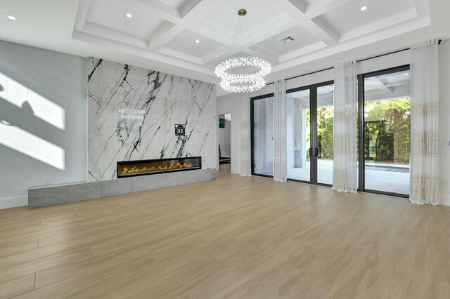 bathroom featuring vanity, a shower, a wealth of natural light, and hardwood / wood-style floors