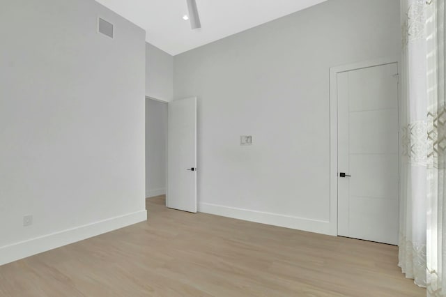 unfurnished room with light hardwood / wood-style flooring