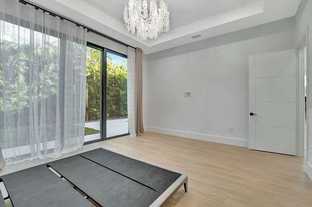 interior space featuring dark wood-type flooring and a chandelier