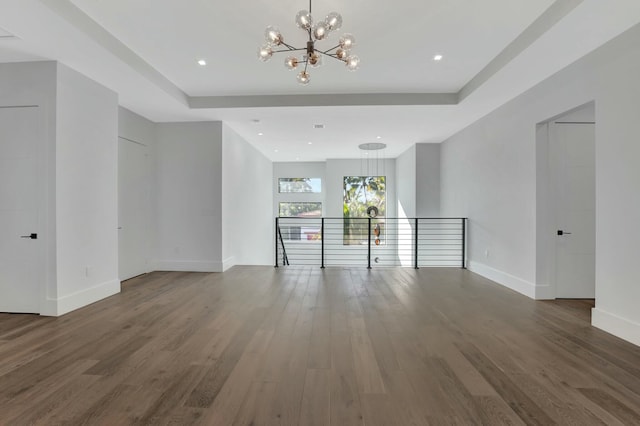 interior space with an inviting chandelier and dark hardwood / wood-style flooring