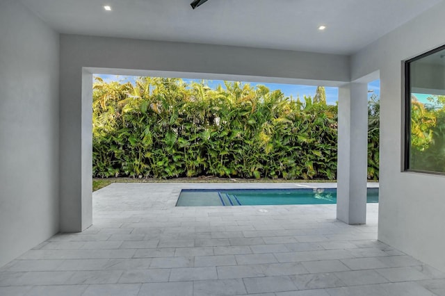 view of swimming pool featuring a patio