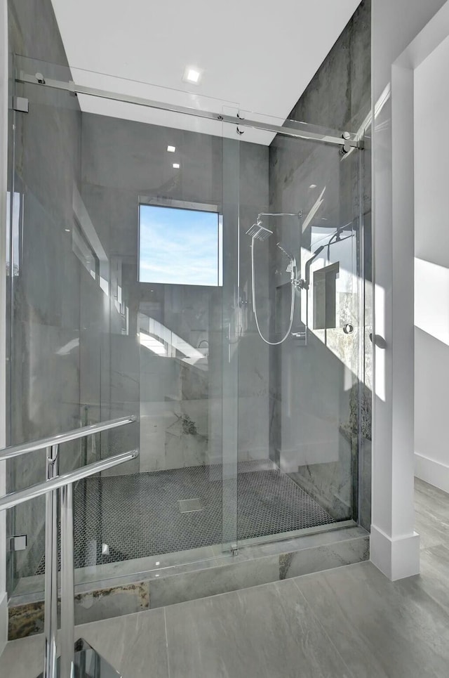 bathroom with a shower with shower door