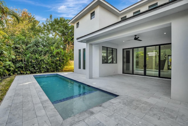 view of pool with a patio and ceiling fan