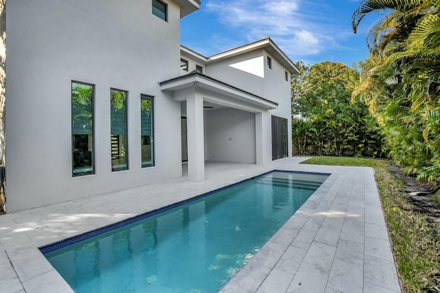 back of house featuring a patio area